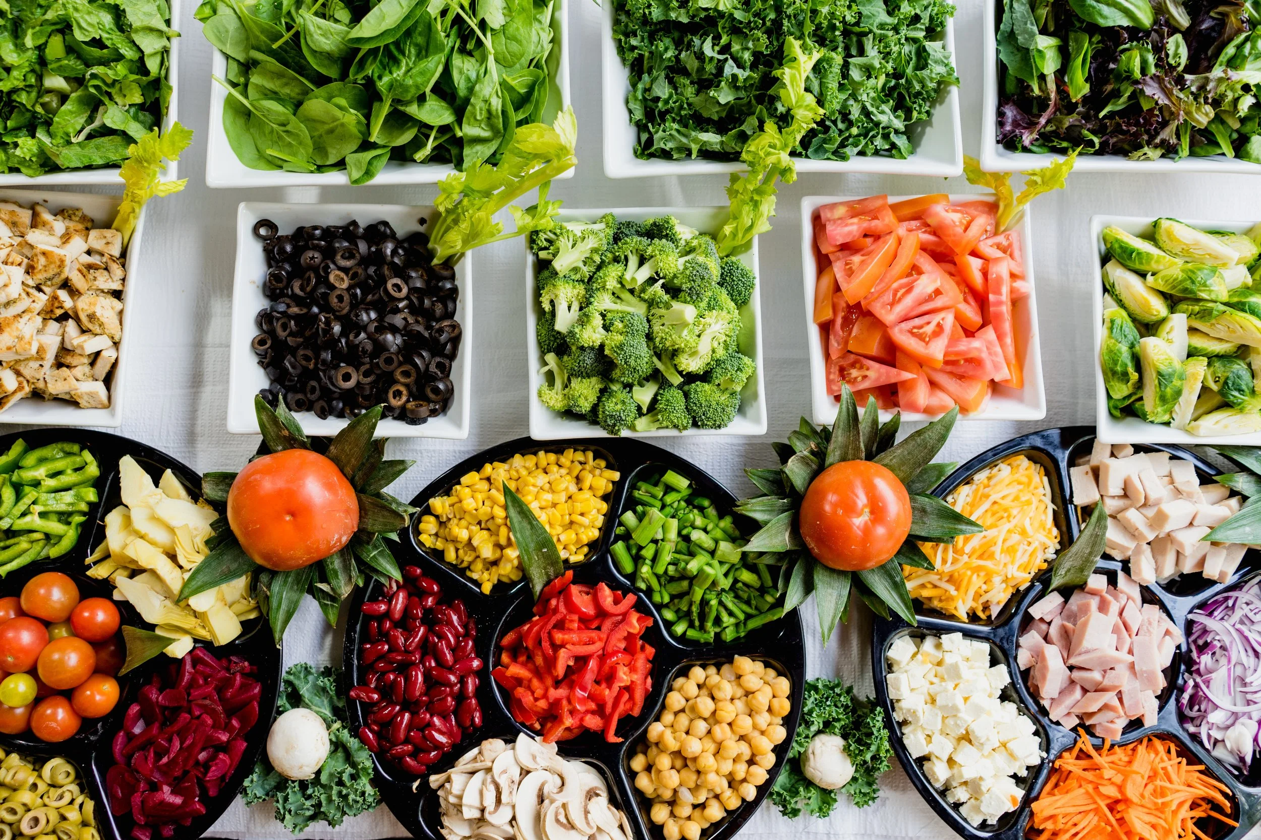 A variety of fresh, healthy ingredients, mostly fruits and vegetables, creating a sense of nutritional wholeness.